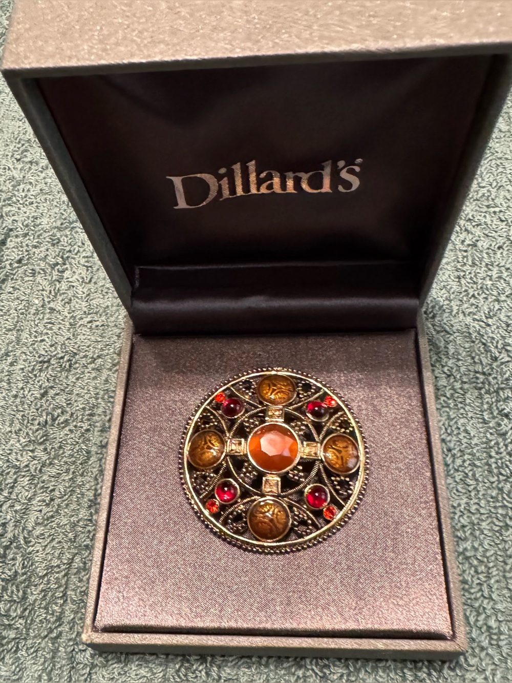 Vintage circular brooch - stylized Celtic or Anglo-Saxon knotwork design .